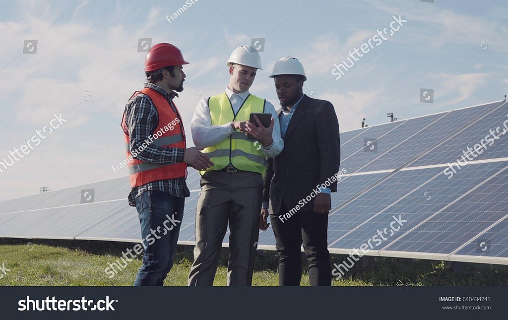 Engineers reviewing a commercial solar installation